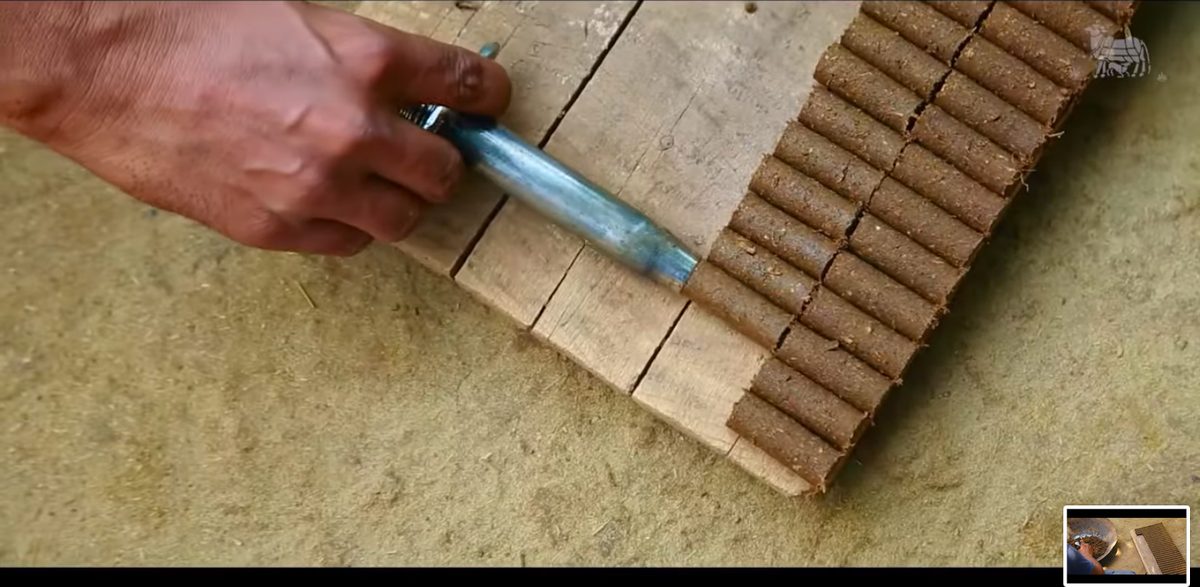 Dhoop sticks being rolled one by one on a wooden board