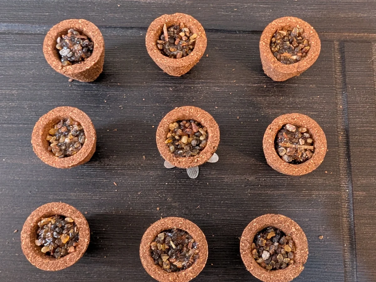 Nine guggal sambrani cups, each packed with resin